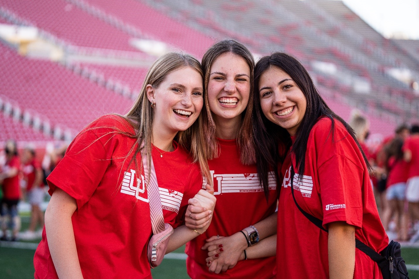 undergraduate students smiling at the stadium